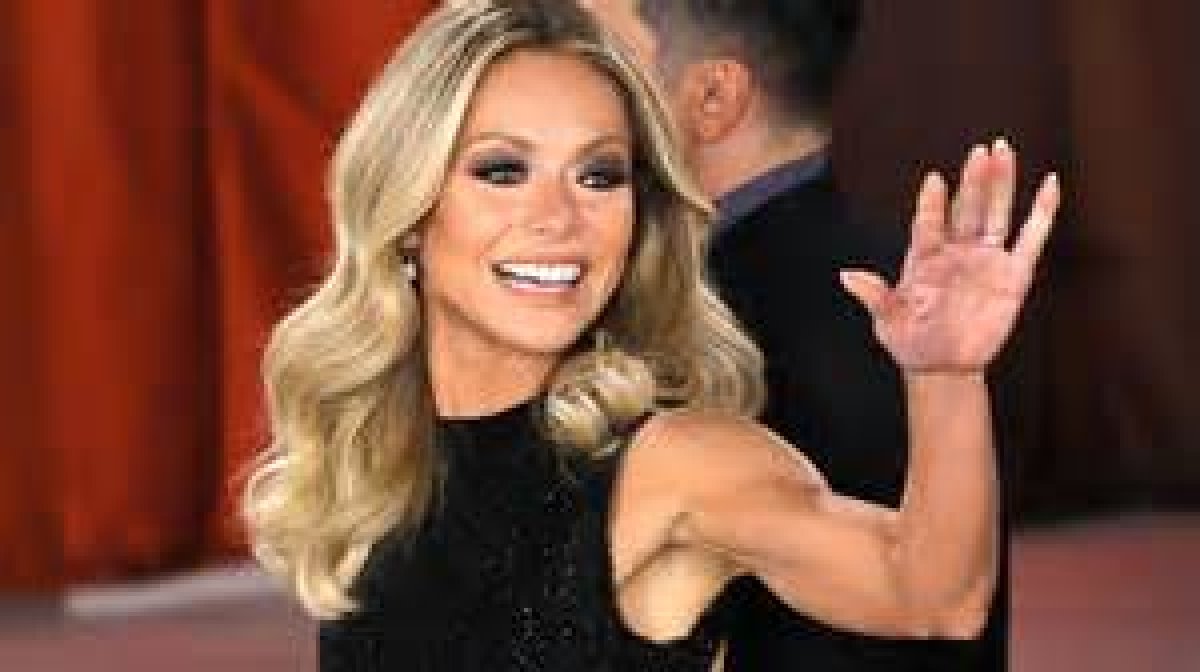 Kelly Ripa Is a Beach Bombshell in Red Hot Swimsuit Alongside Husband Mark Consuelos